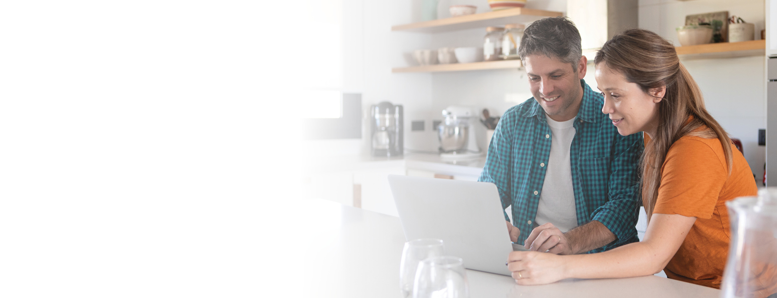 Couple using Financial Focus on laptop.